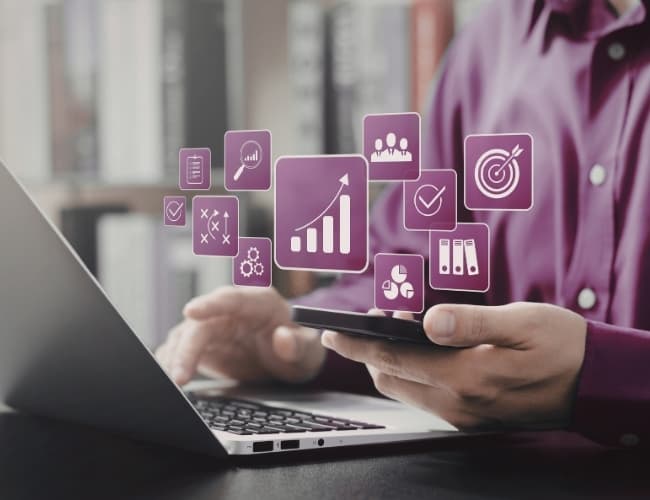 Person using a tablet with data charts and analytics