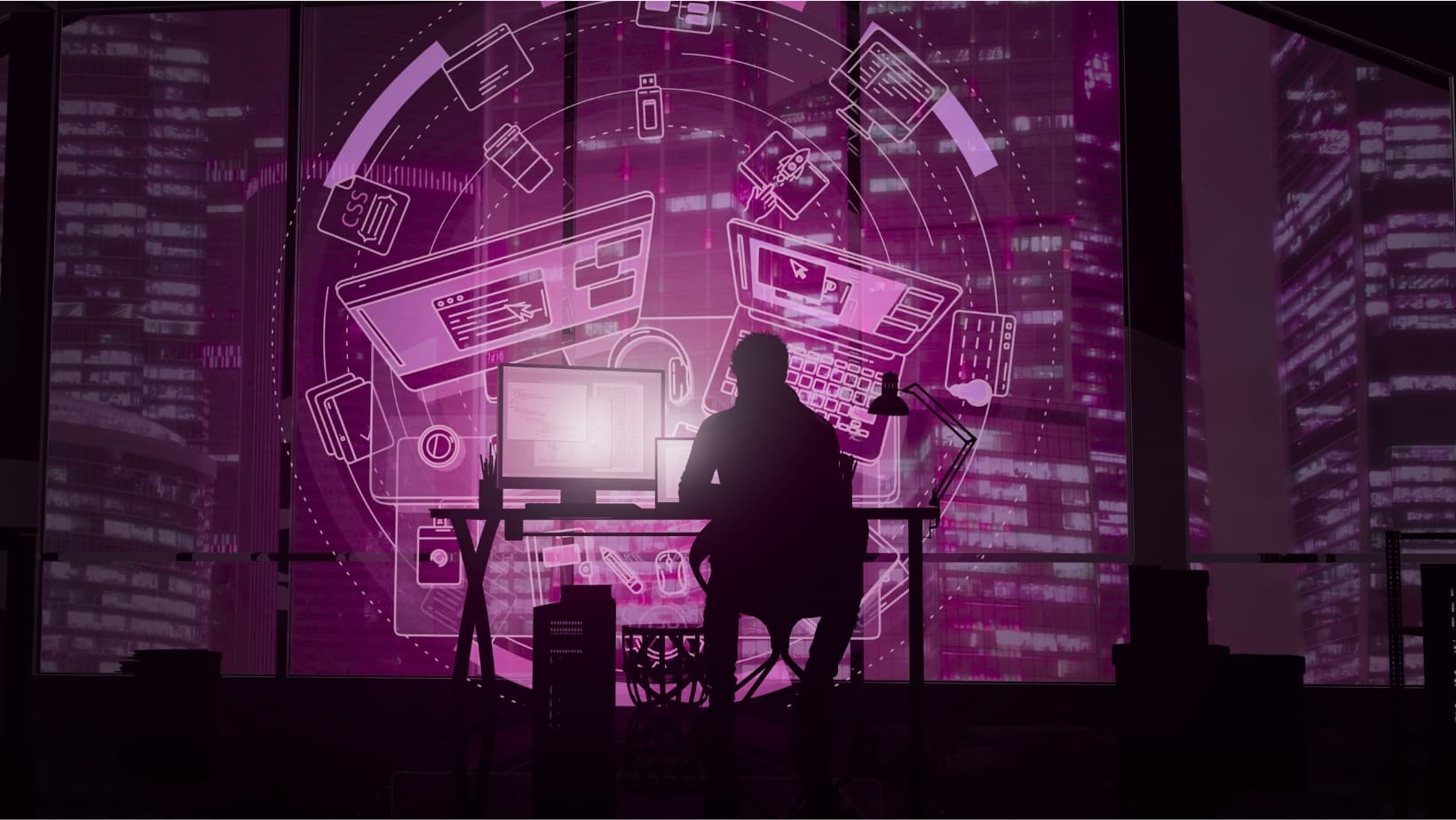 Developer working at a computer in a modern workspace with purple lighting
